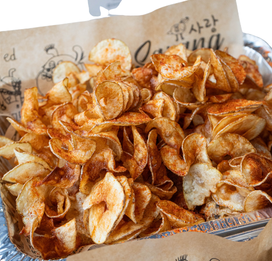 Sarang Kitchen tornado cut chips in branded paper bag